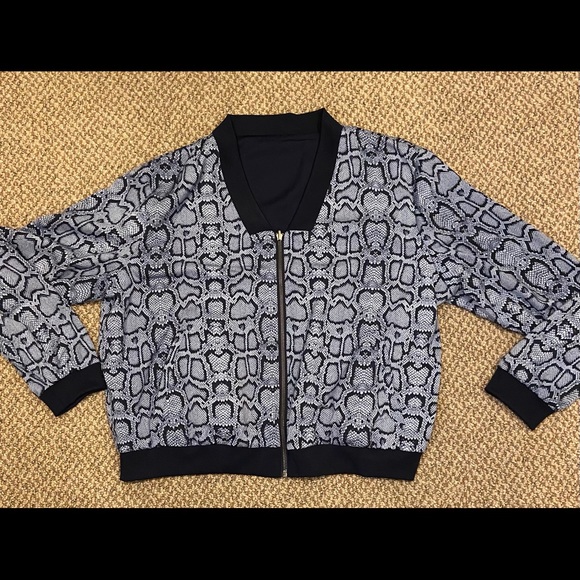 Stella & Dot Reversible Bomber Python/Navy
Size XL - Picture 1 of 2
